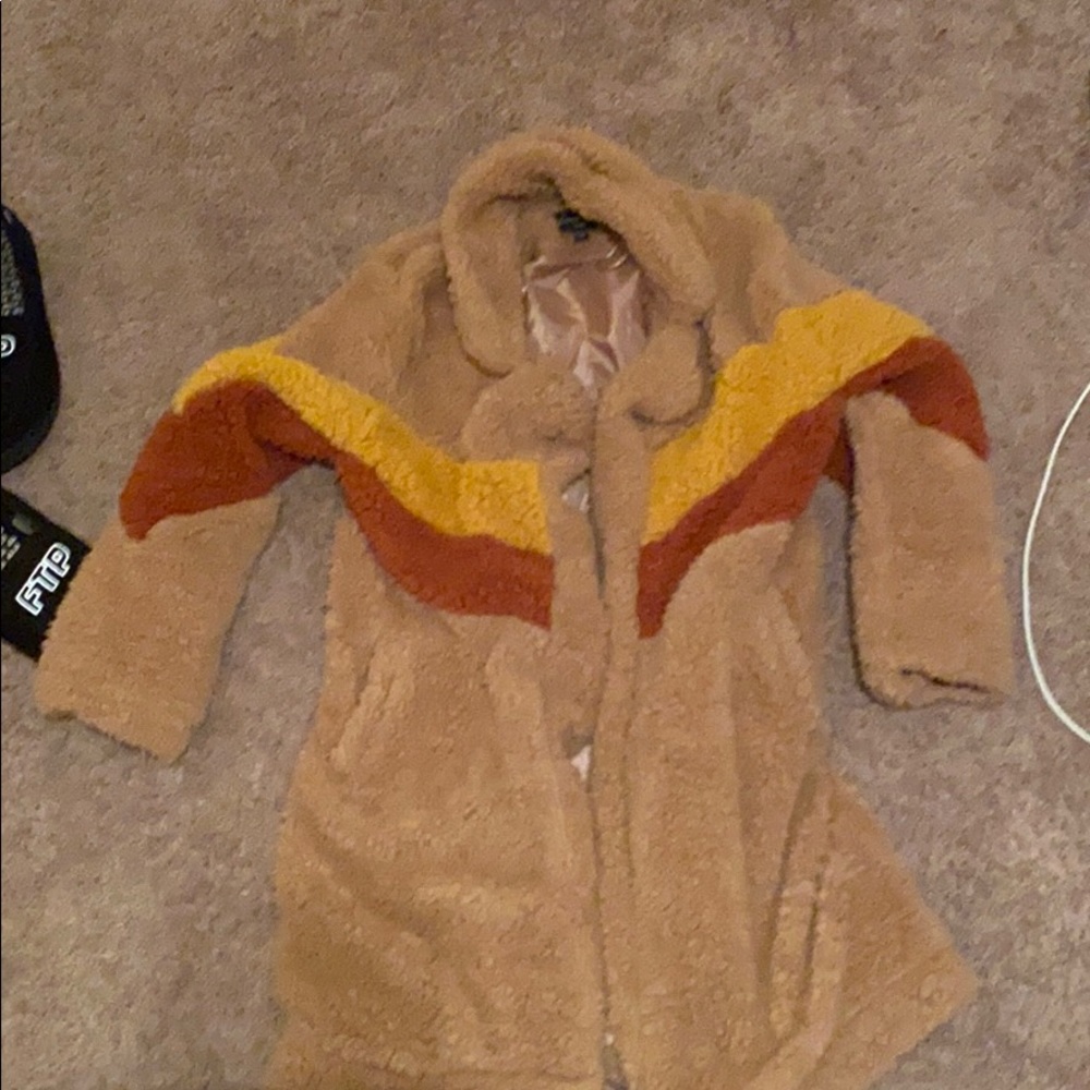 A tan Sherpa jacket knee length, worn twice